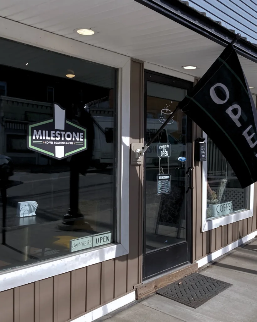 milestone coffee roasting & cafe storefront with open sign and dark windows., milestone coffee, montrose
