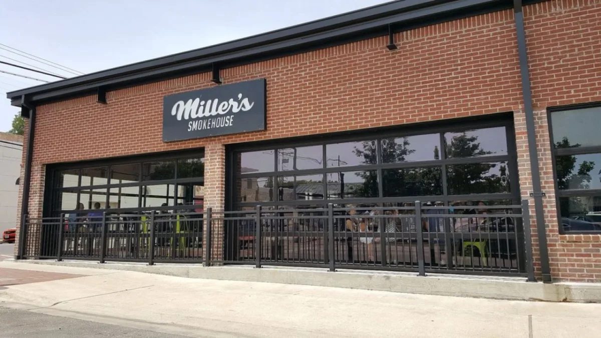 miller's smokehouse restaurant storefront with brick exterior and metal railings., miller's smokehouse, temple