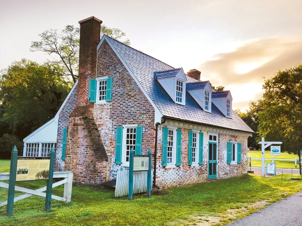 historic brick cottage with turquoise shutters and metal roof., mobjack bay coffee roasters and petite cafe, yorktown