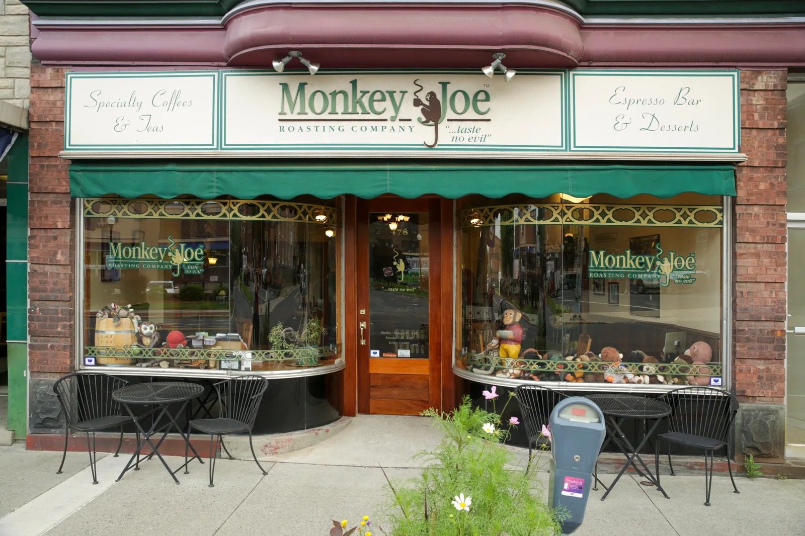 monkey joe roasting company storefront with green awning and display windows., monkey joe roasting company, kingston