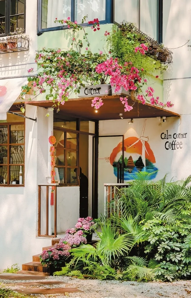 charming café entrance adorned with cascading pink flowers and lush green plants., mr piki (north district), wenyuan village
