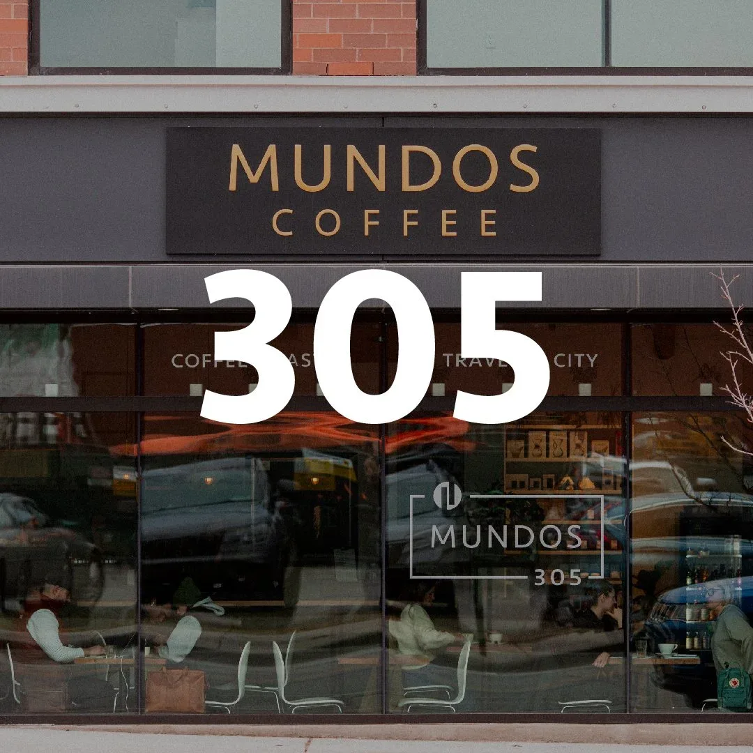 mundos coffee storefront at address 305 with large window display and signage., mundos roasting & co., traverse city