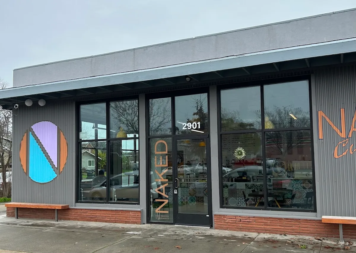 modern storefront with orange and blue geometric logo design, address 2901 visible., naked coffee, sacramento