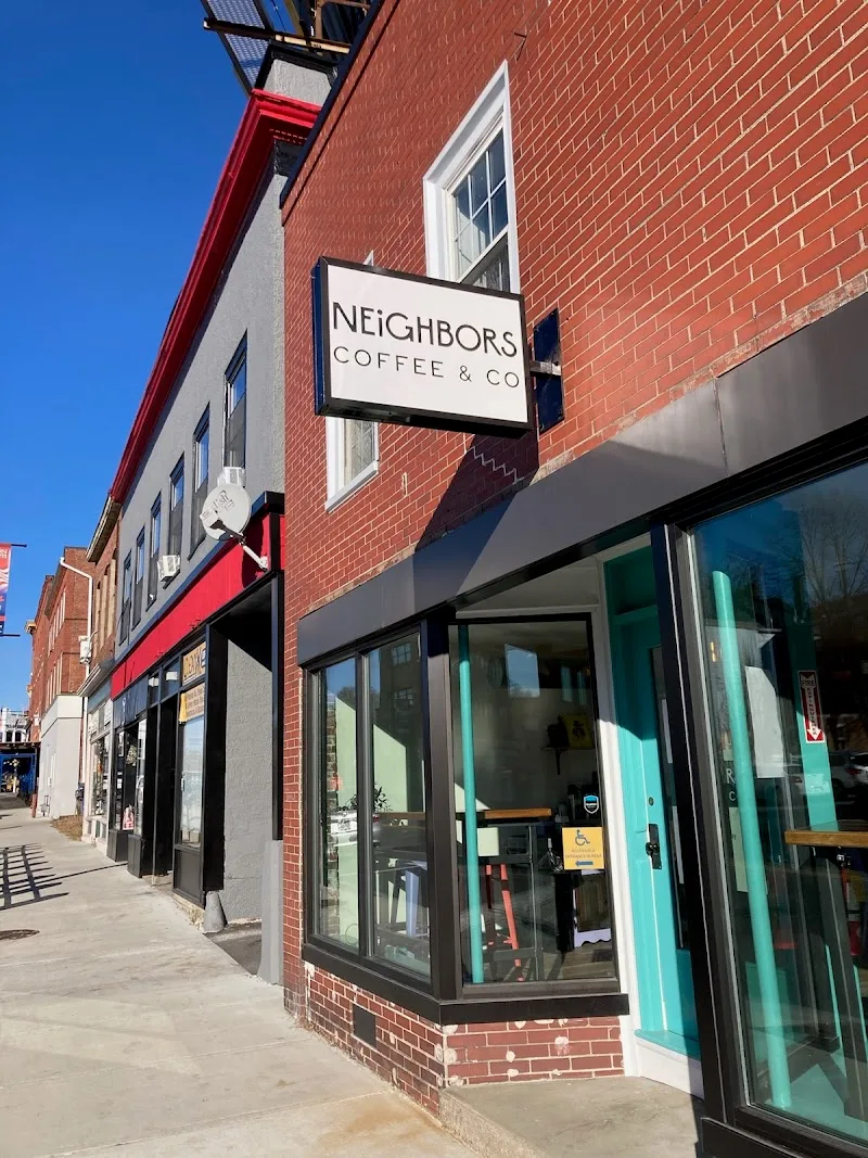 neighbors coffee & co storefront with red awning on brick street corner., neighbors coffee & co., taunton