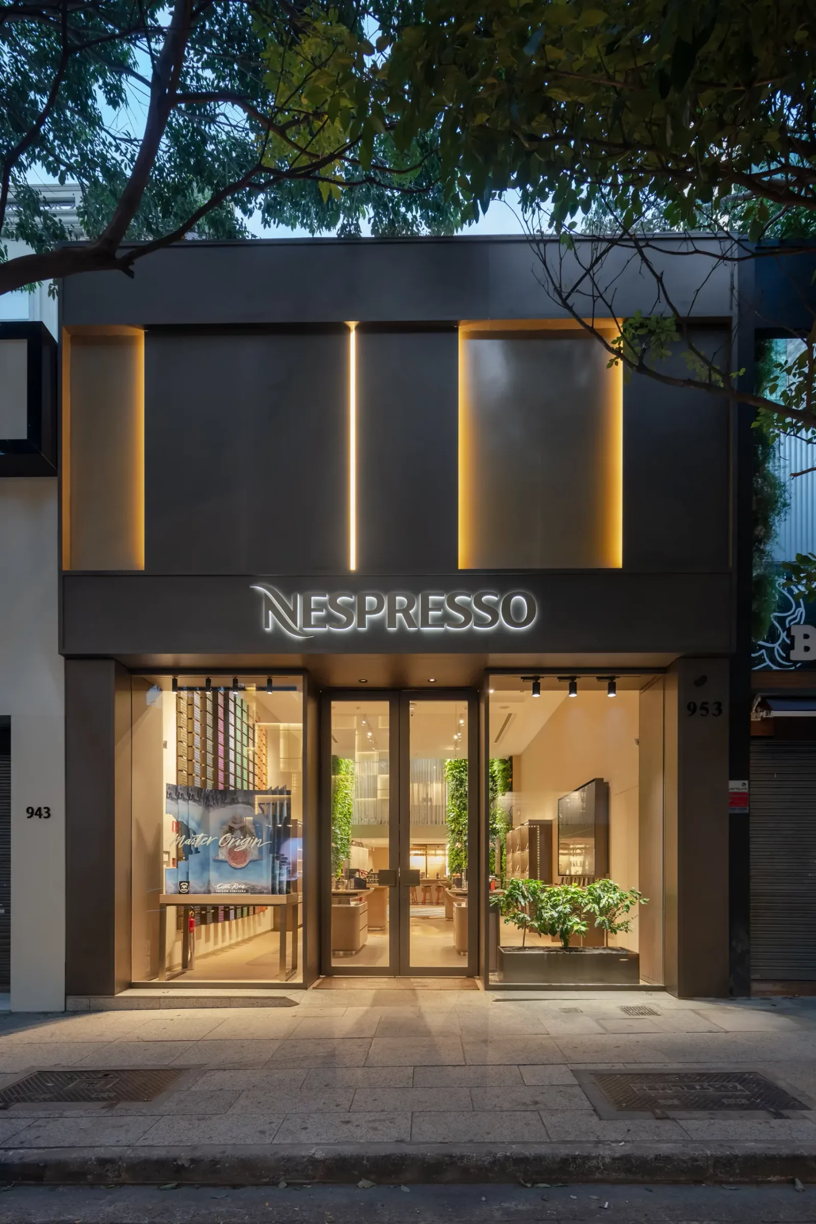 modern nespresso boutique storefront with illuminated facade and warm interior lighting., nespresso boutique, são paulo