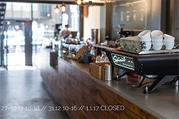 modern coffee shop interior with espresso machine, cups, and storefront windows., nord coast coffee roastery, hamburg