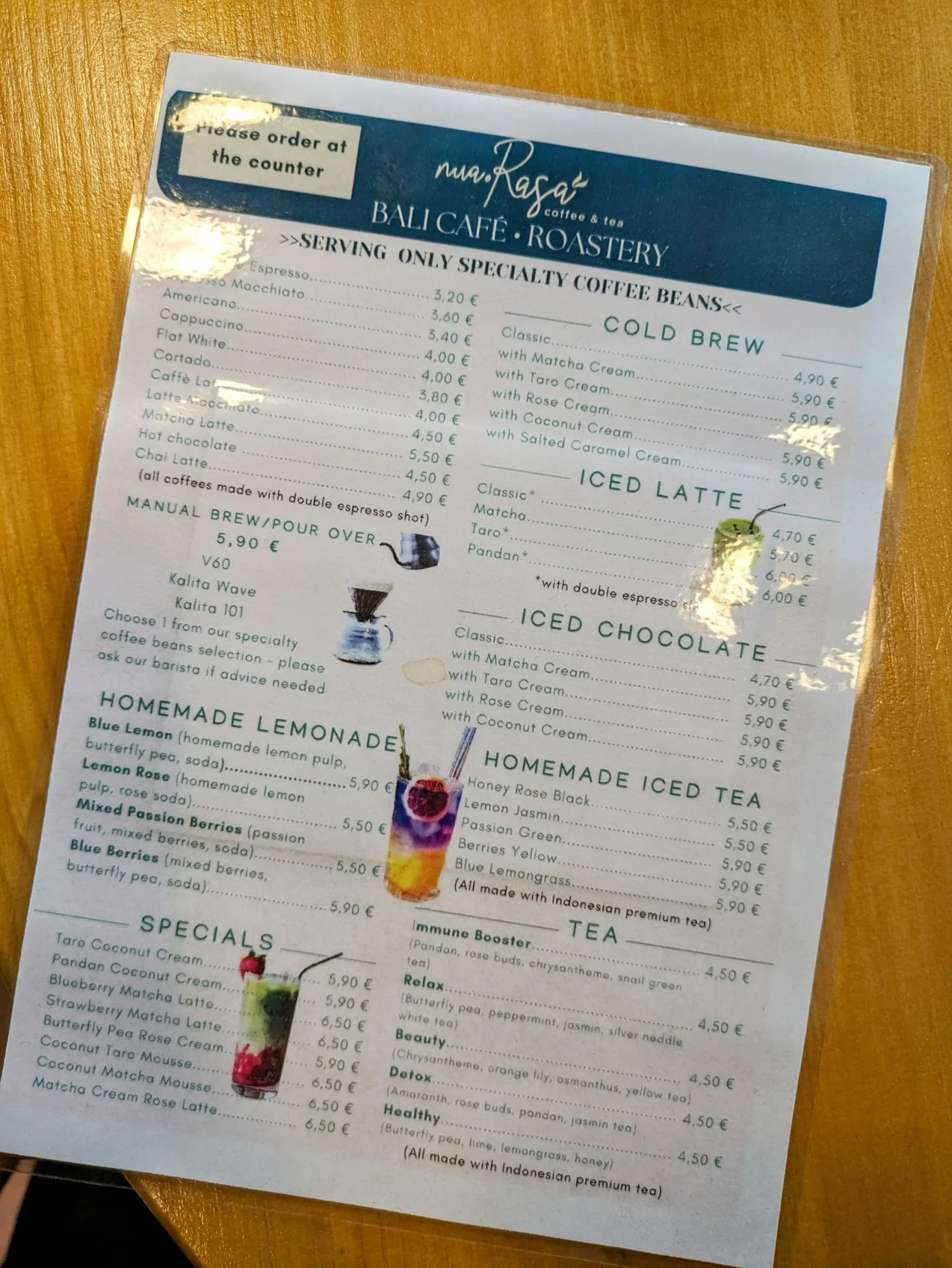 menu from rogat bali café roastery with coffee and beverage prices listed in euros., nua rasa, berlin