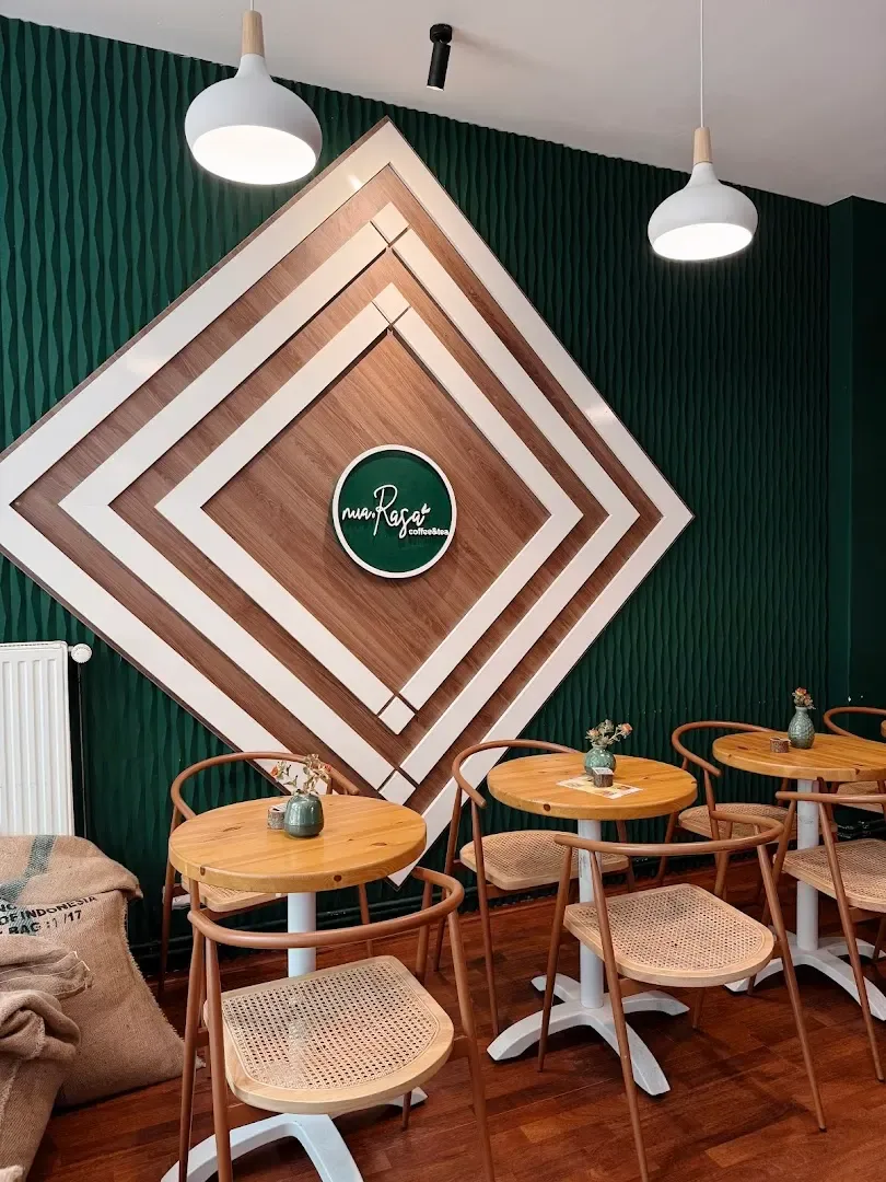 modern café interior with geometric wood wall art and mid-century dining furniture., nua rasa, berlin
