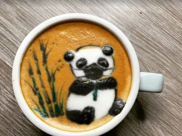 hand-poured panda latte art with bamboo design in white ceramic cup., panda cup, blackfriars, london