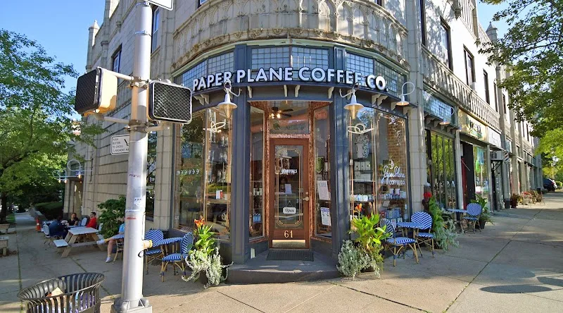 paper plane coffee co storefront with outdoor seating and potted plants., paper planes coffee co., montclair