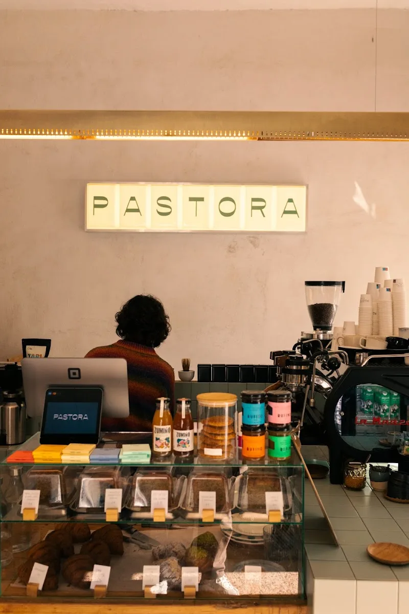 pastora coffee shop interior with barista, espresso machine, and display cases., pastora – café & bottle shop, madrid