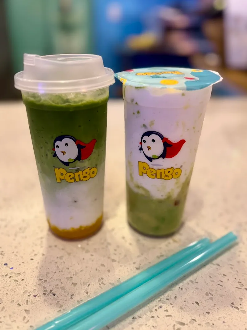 two penso branded bubble tea drinks with layered beverages and colorful lids on counter., pengo drink station, laguna hills