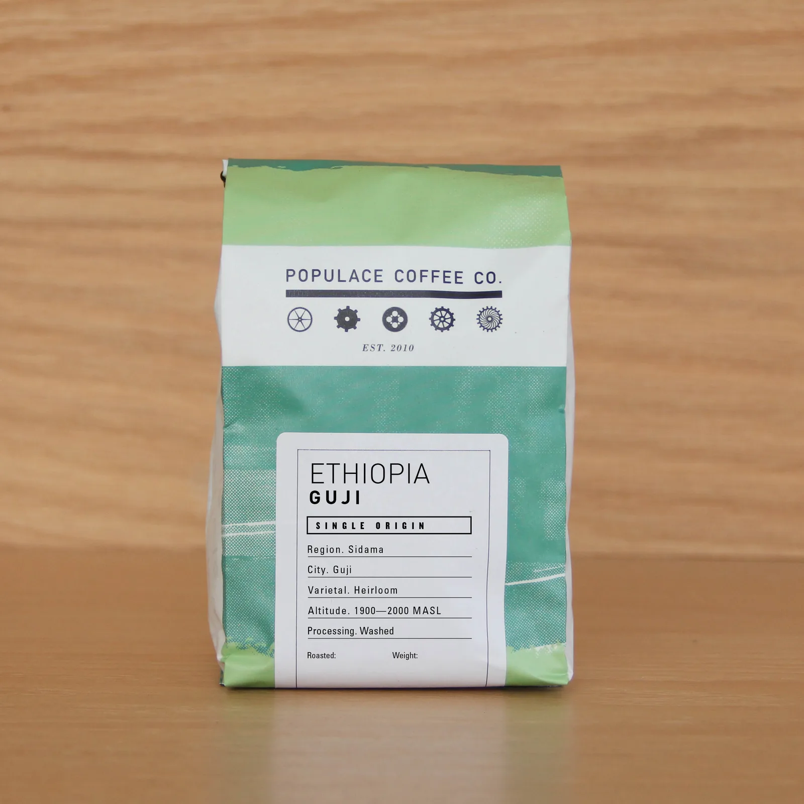 populace coffee co. ethiopia guji single origin coffee bag on wooden surface., populace coffee, bay city