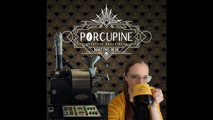 person in yellow shirt drinking from cup at porcupine coffee roasting establishment., porcupine coffee roasting, plymouth