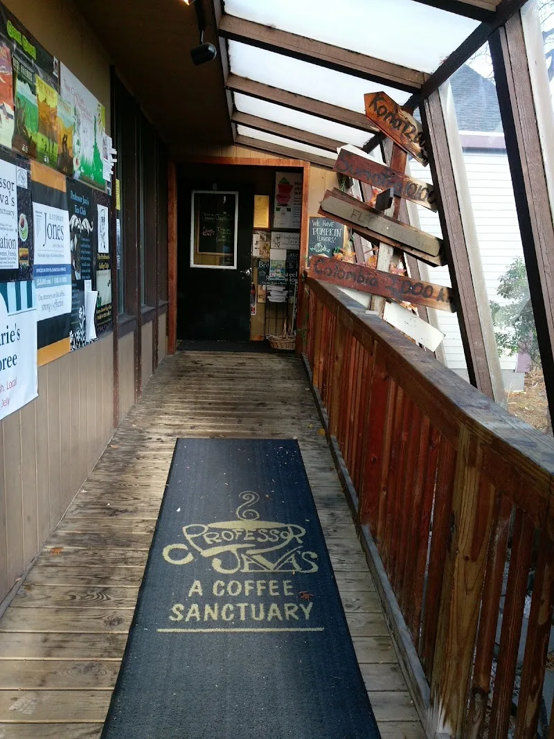 narrow wooden walkway leading to coffee shop entrance with welcoming mat., professor java's coffee sanctuary, new york