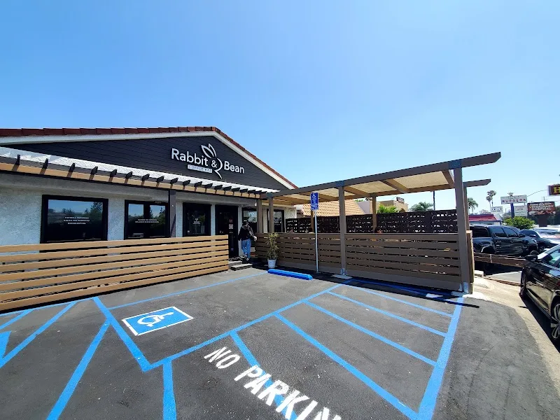 rabbit & bean cafe storefront with wooden paneling and accessible parking spaces., rabbit and bean coffee bar, la habra