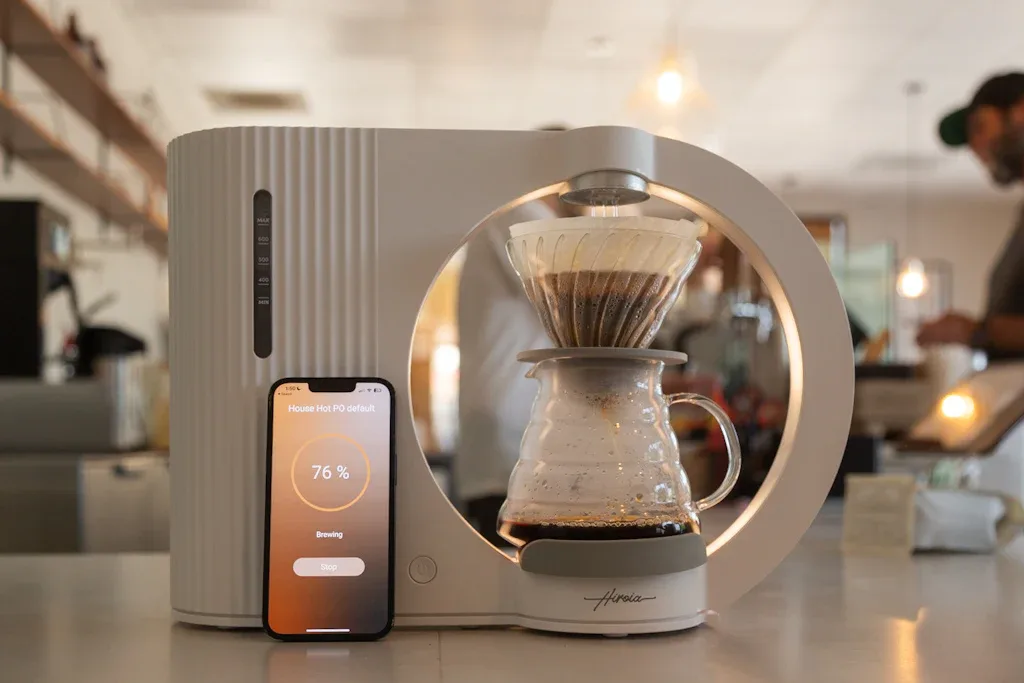 smart coffee maker brewing with smartphone app showing 76% progress., regent coffee roasters and brew bar, los angeles
