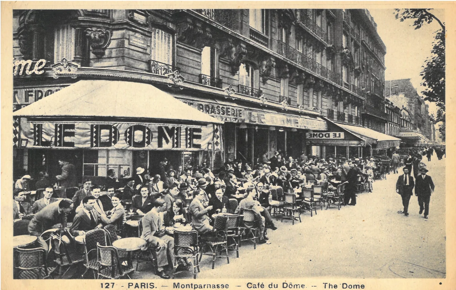 crowded parisian café terrace with diners under awning, belle époque architecture., restaurant bistrot le dôme paris 15, pari