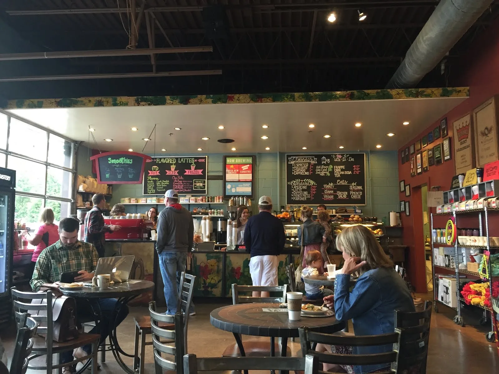 busy coffee shop interior with customers, menu boards, and serving counter., rev coffee, atlanta