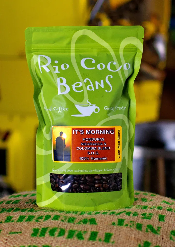 rio coco beans coffee package on burlap with green background blur., rio coco beans, vero beach