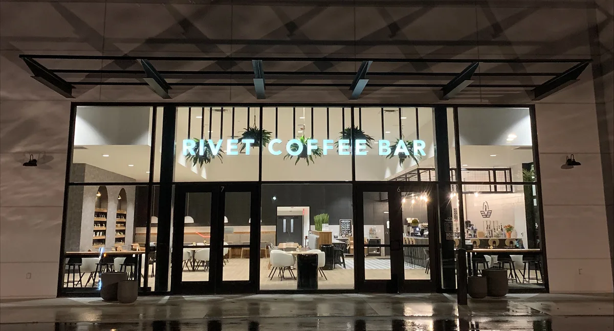 river 2 coffee bar storefront with modern glass facade and interior seating visible., rivet coffee bar and roastery, indianap