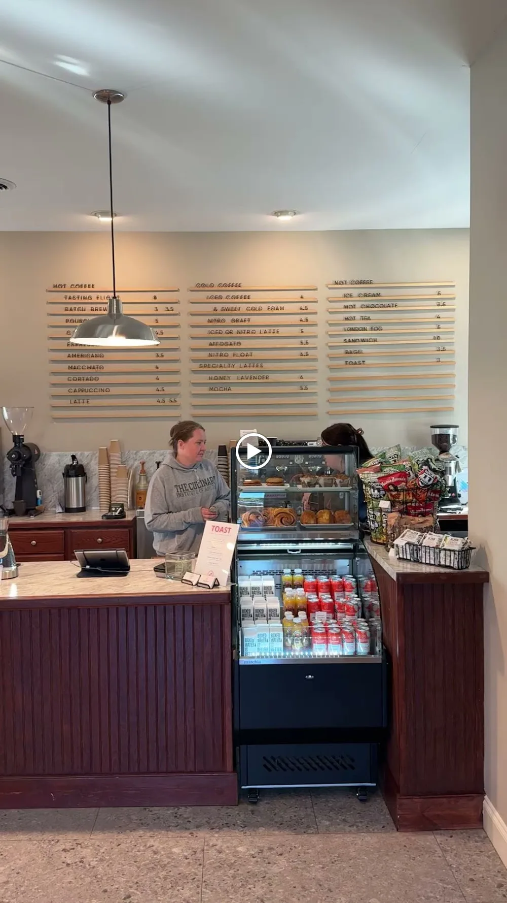 coffee shop counter with menu boards, barista, and refrigerated display case., roadmap coffeeworks - roastery, tasting room a