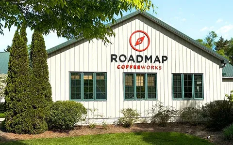 white building with "roadmap coffee works" red logo and signage on facade., roadmap coffeeworks - roastery, tasting room and 