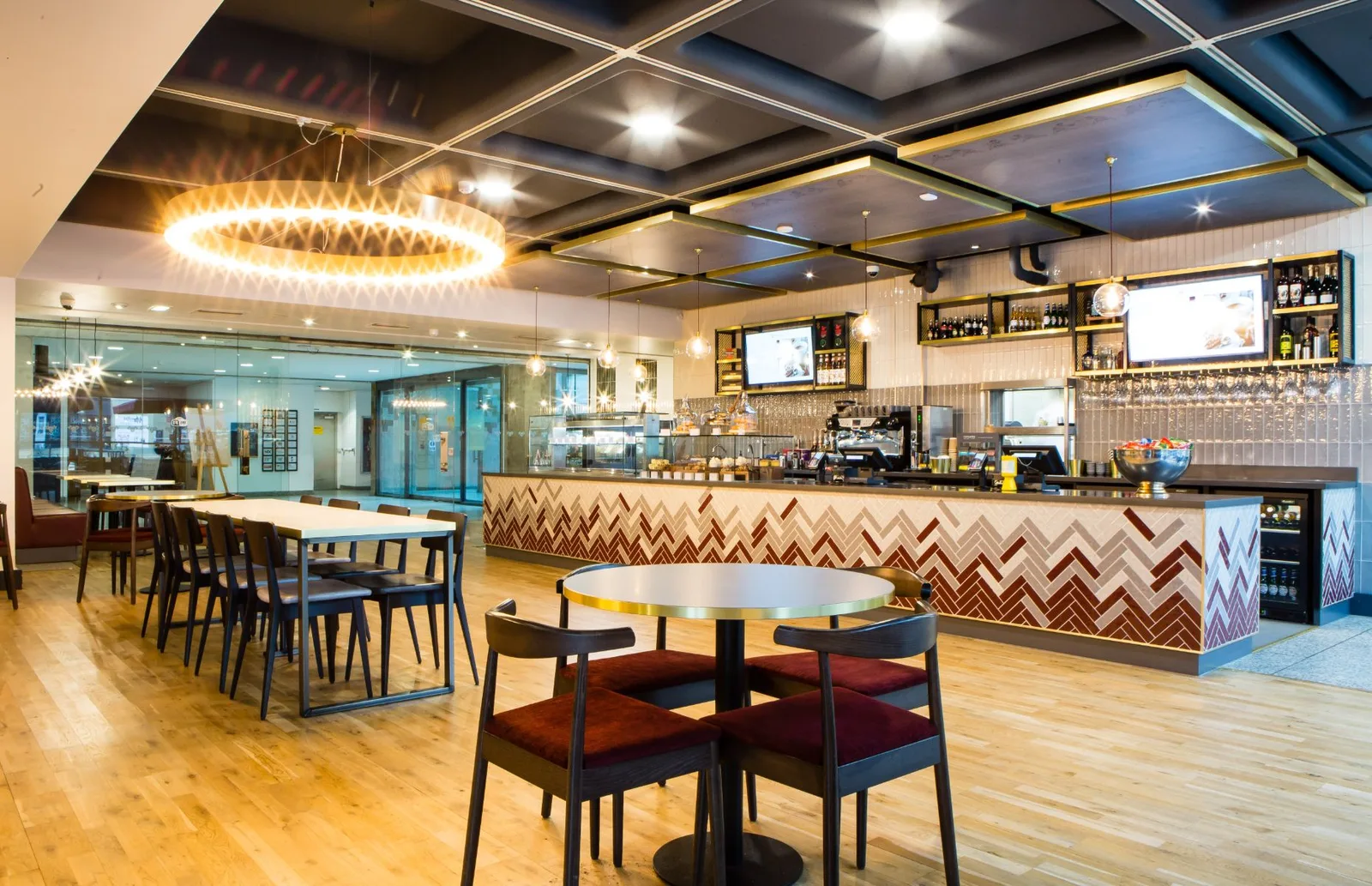 modern cafe interior with bar counter, dining tables, and geometric ceiling design., royal armouries museum, leeds