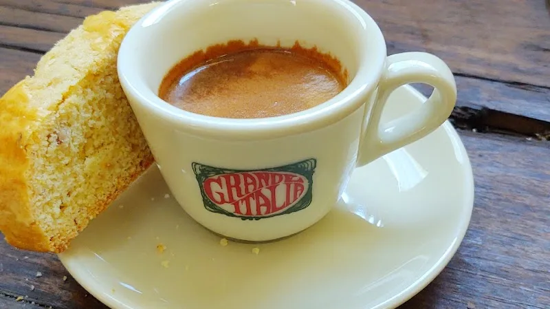 espresso cup with branding on saucer next to toasted bread slice., sacuzzo coffee, newington