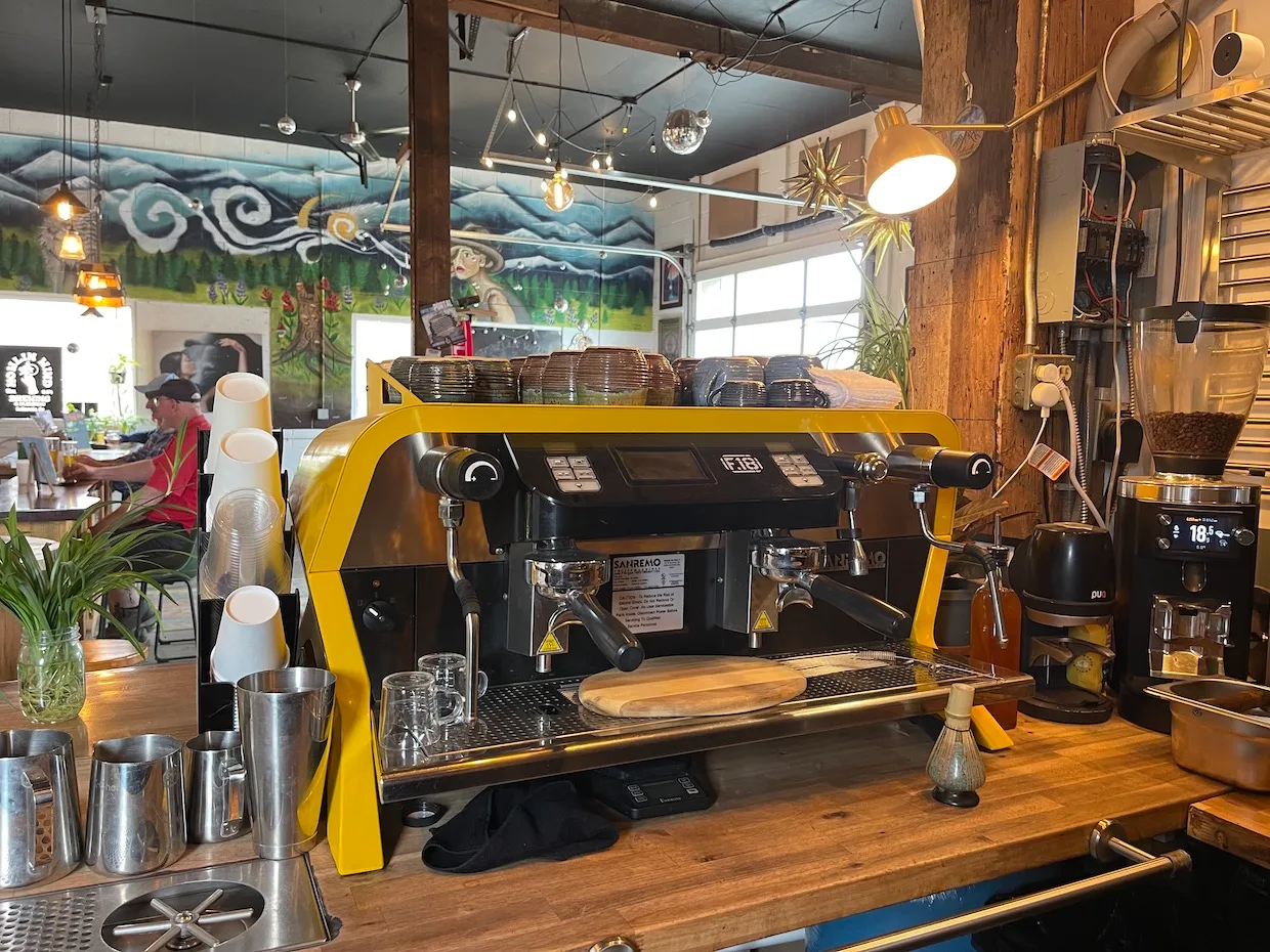 yellow and black espresso machine on wooden counter in artisan coffee shop., salto coffee, boulder