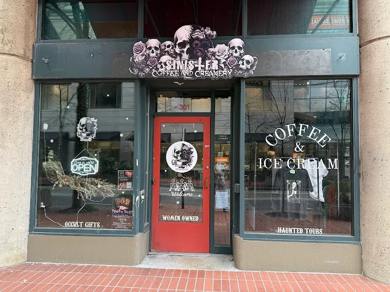 goth-themed coffee and creamery storefront with skull decorations and red door., sinister coffee and creamery, portland