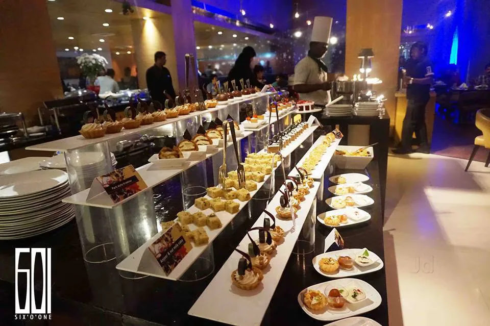 elegant buffet display with pastries and appetizers at upscale event venue., six 'o' one, chennai