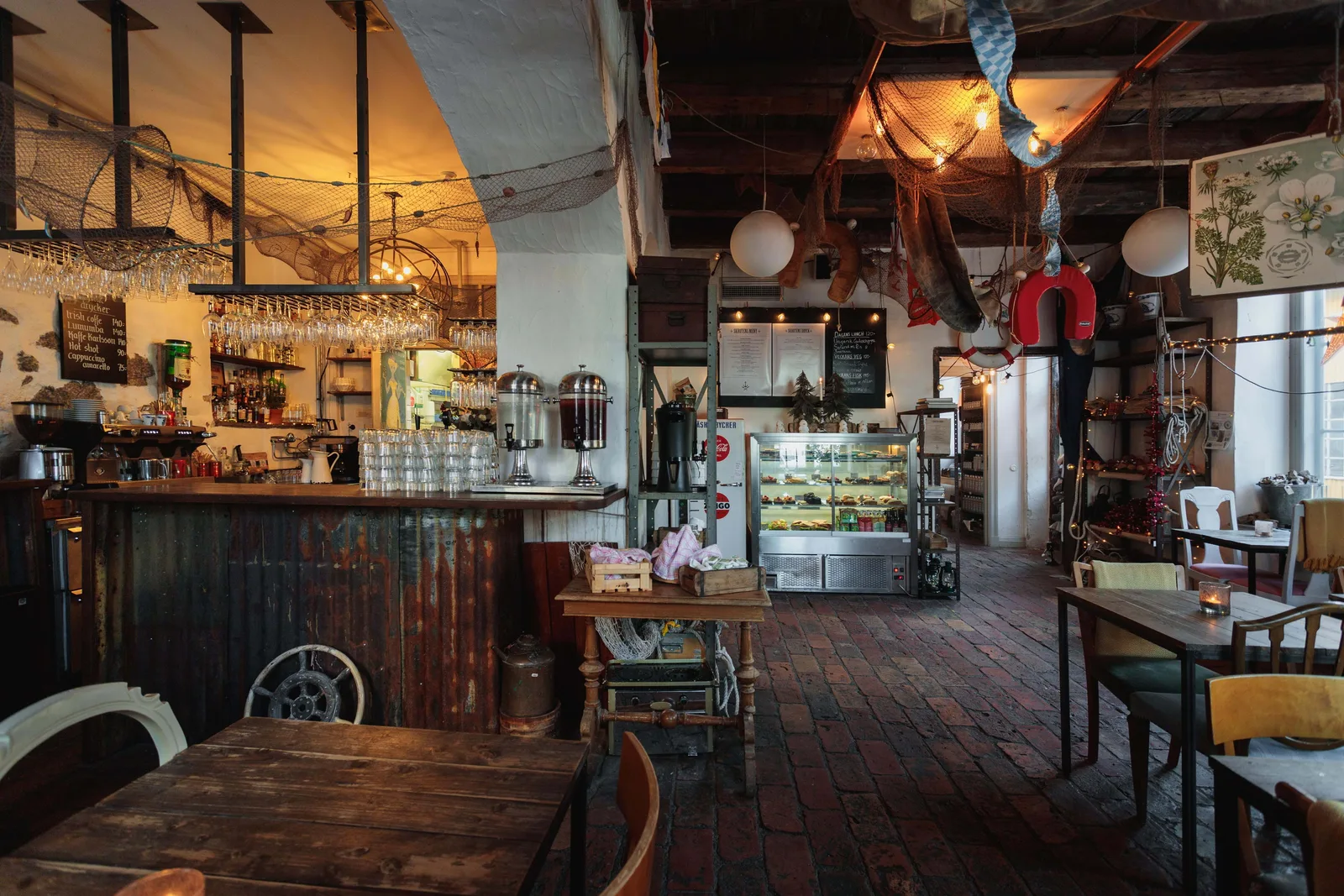 eclectic vintage-themed café with nautical decor and mismatched furnishings throughout., skroten café & skeppshandel, stockho