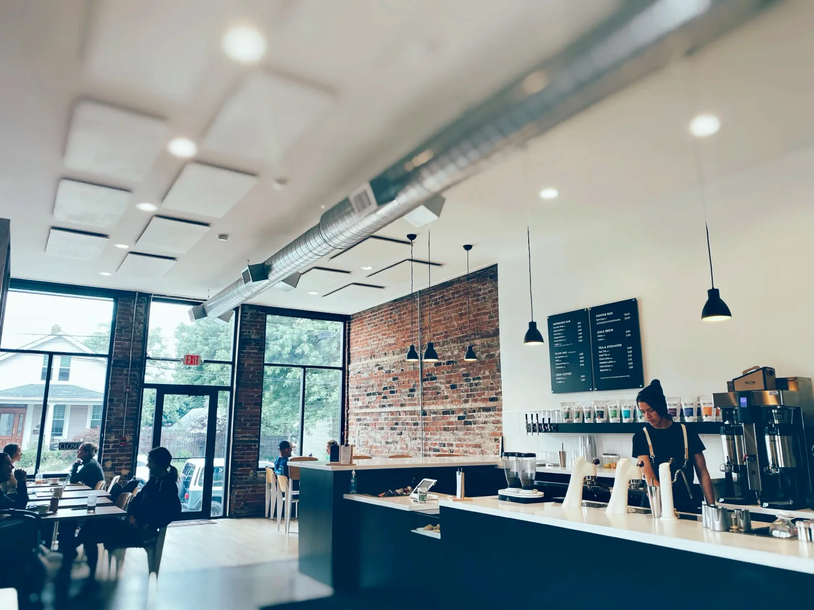 modern coffee shop interior with exposed brick, skylights, and industrial ductwork., smalltown coffee co., crown point