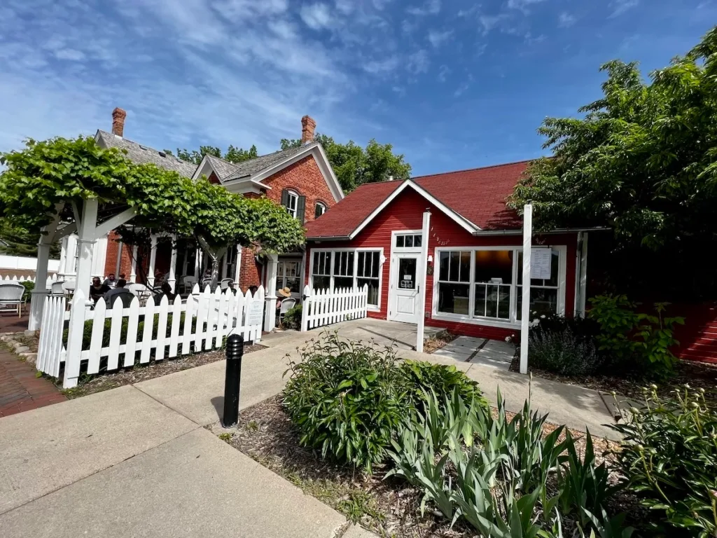 charming red and brick cottages with white picket fence and landscaping., smith coffee & cafe, eden prairie