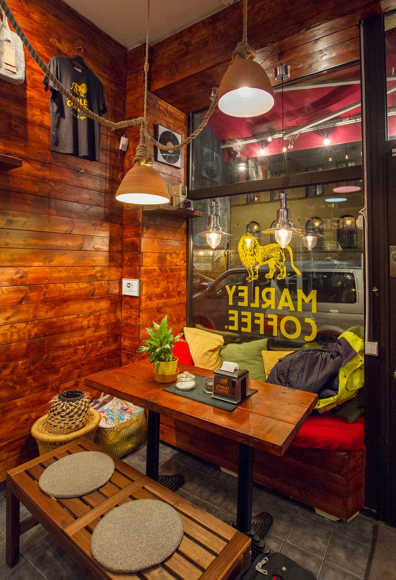 warm wooden café interior with pendant lamps and cozy seating area., söder marley cafe, stockholm