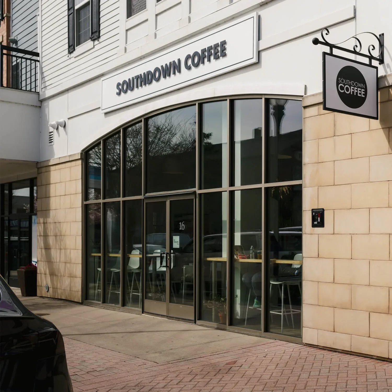 southdown coffee storefront with large windows and black signage at street level., southdown coffee, huntington