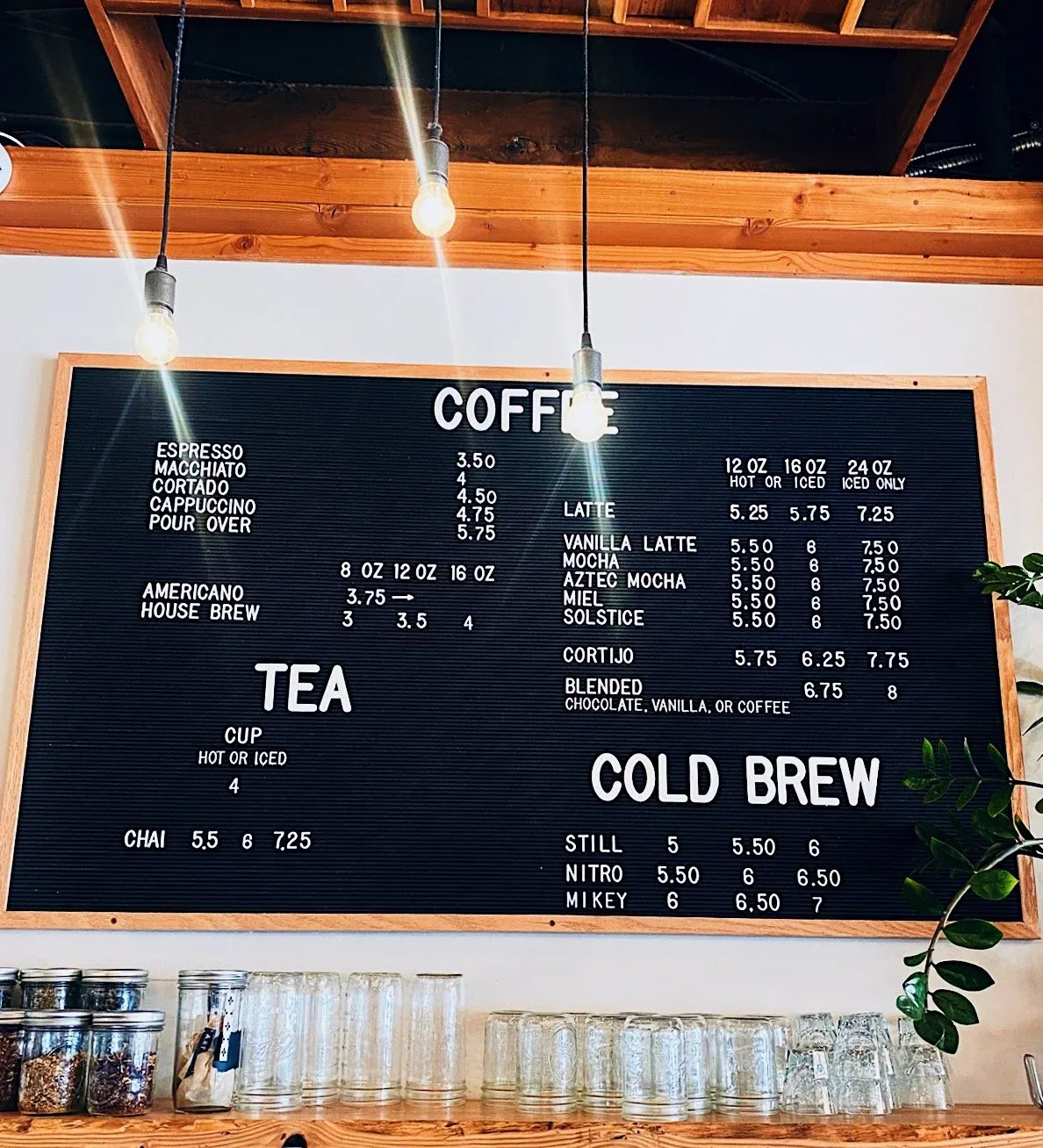 coffee shop menu board displaying espresso drinks, lattes, tea, and cold brew prices., spearhead coffee, paso robles