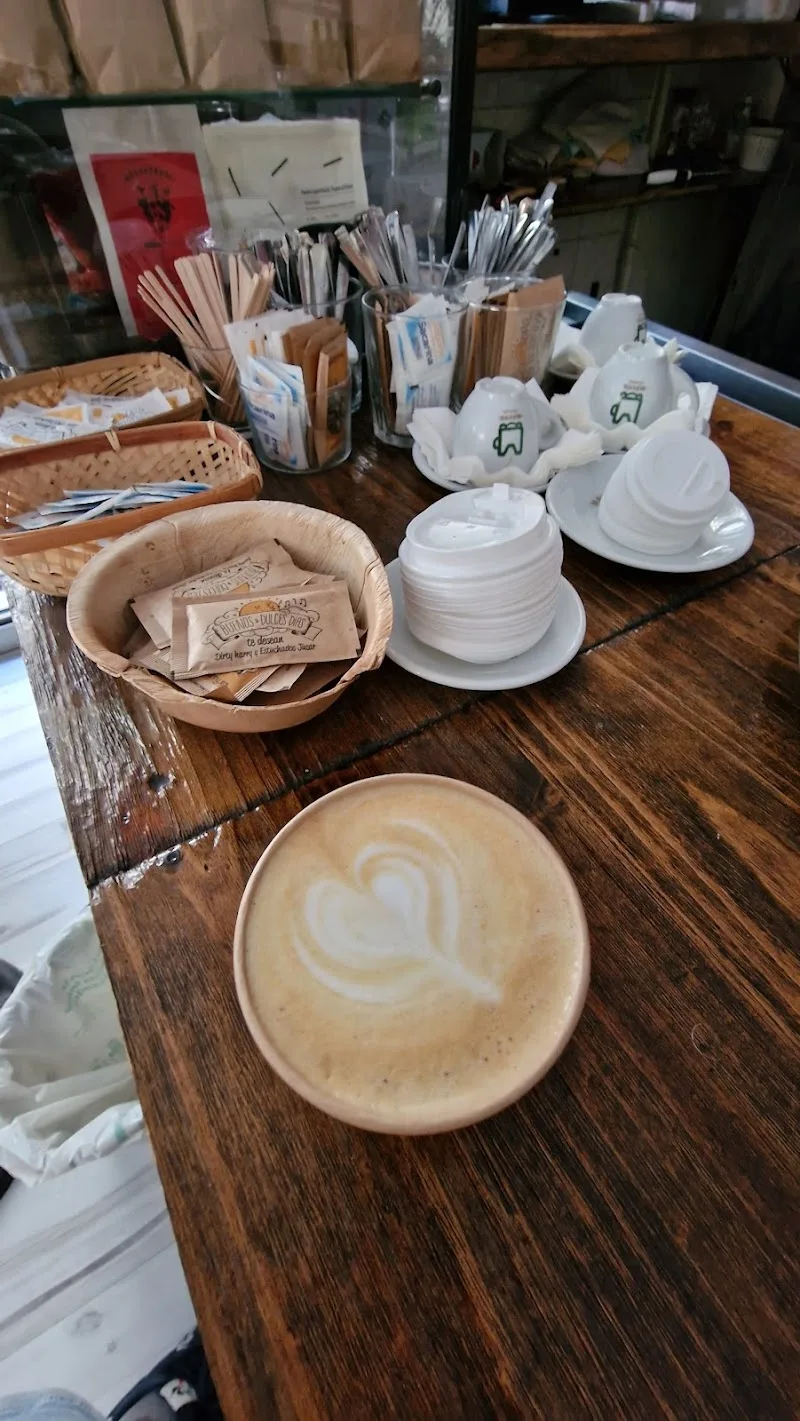 cappuccino with latte art heart, coffee station with supplies and condiments., specialty coffee mayan ☕🥐, valència