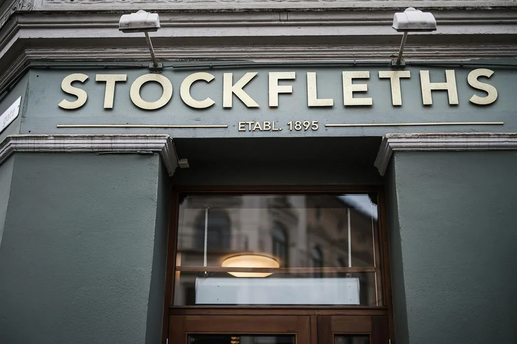 stockfleths storefront established 1895 with green facade and dark wooden door., stockfleths, oslo