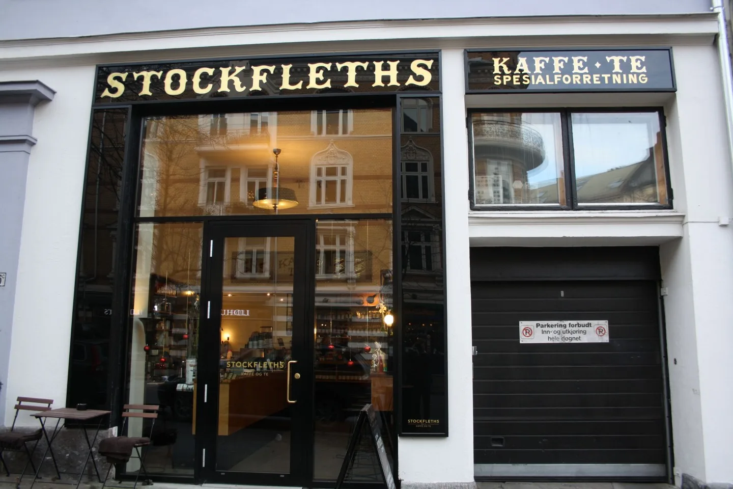 stockfleths café storefront with black frame and gold lettering signage., stockfleths, oslo