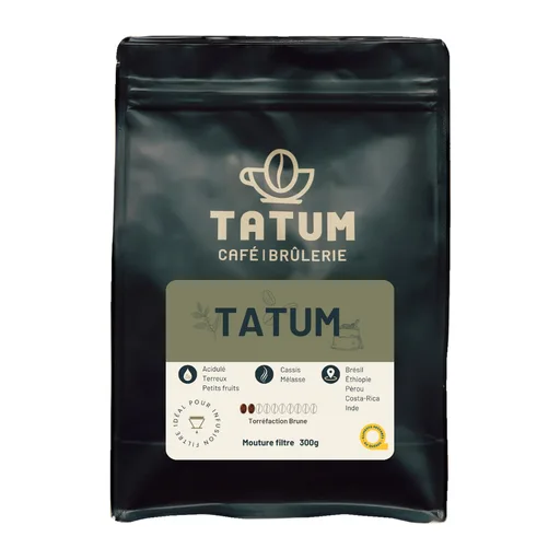 black coffee bag with tatum branding, gold logo, and product information label visible., tatum café et brûlerie, québec city