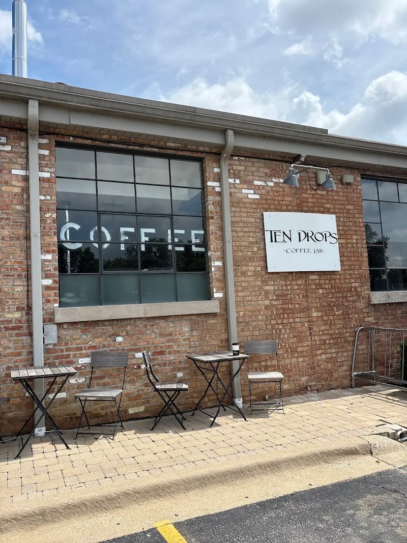 ten drops coffee lab storefront with outdoor seating and large windows., ten drops coffee, chicago