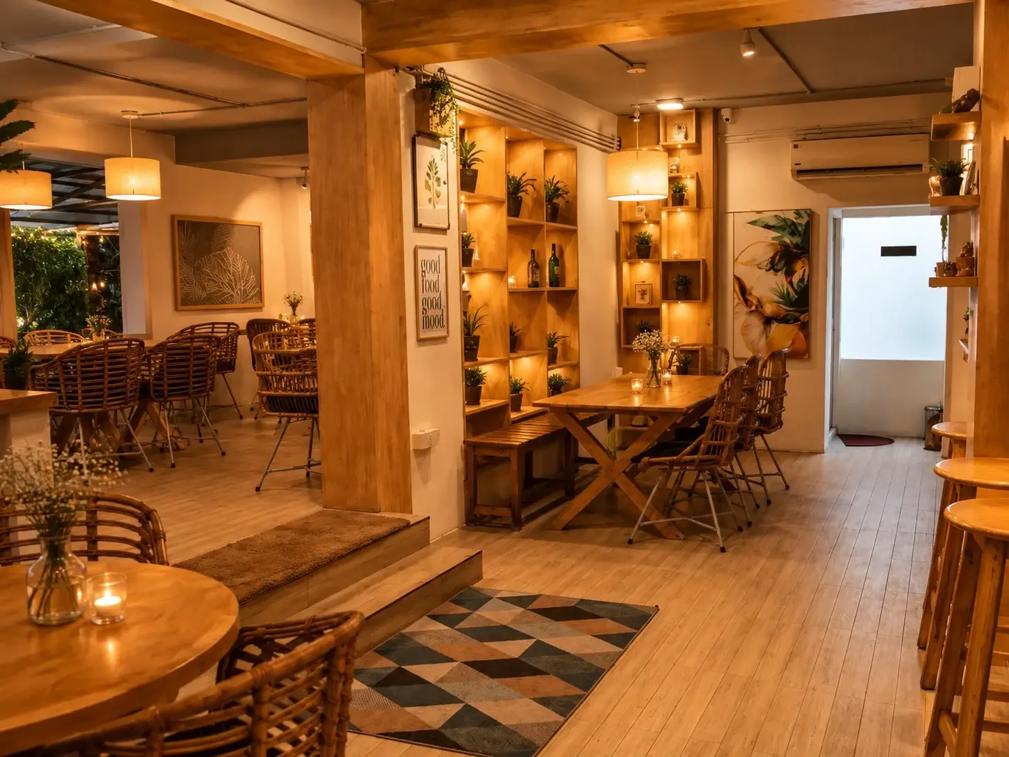warm wooden interior café with shelving, plants, dining tables, and ambient lighting throughout., the freshlymade - resto caf