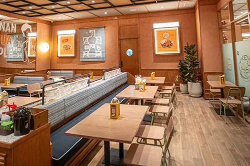 warm wood-paneled restaurant interior with dining tables and service counter., the people's cafe pacific place, jakarta