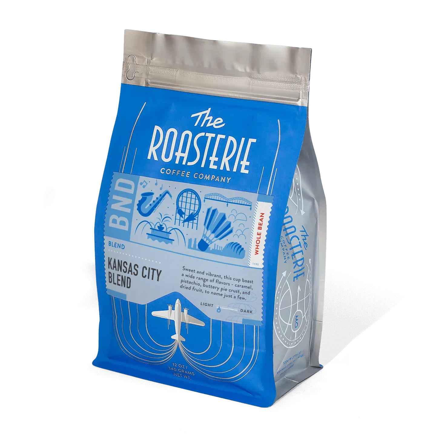 blue coffee bag labeled "kansas city blend" from the roasterie coffee company, 12 oz., the roasterie, kansas