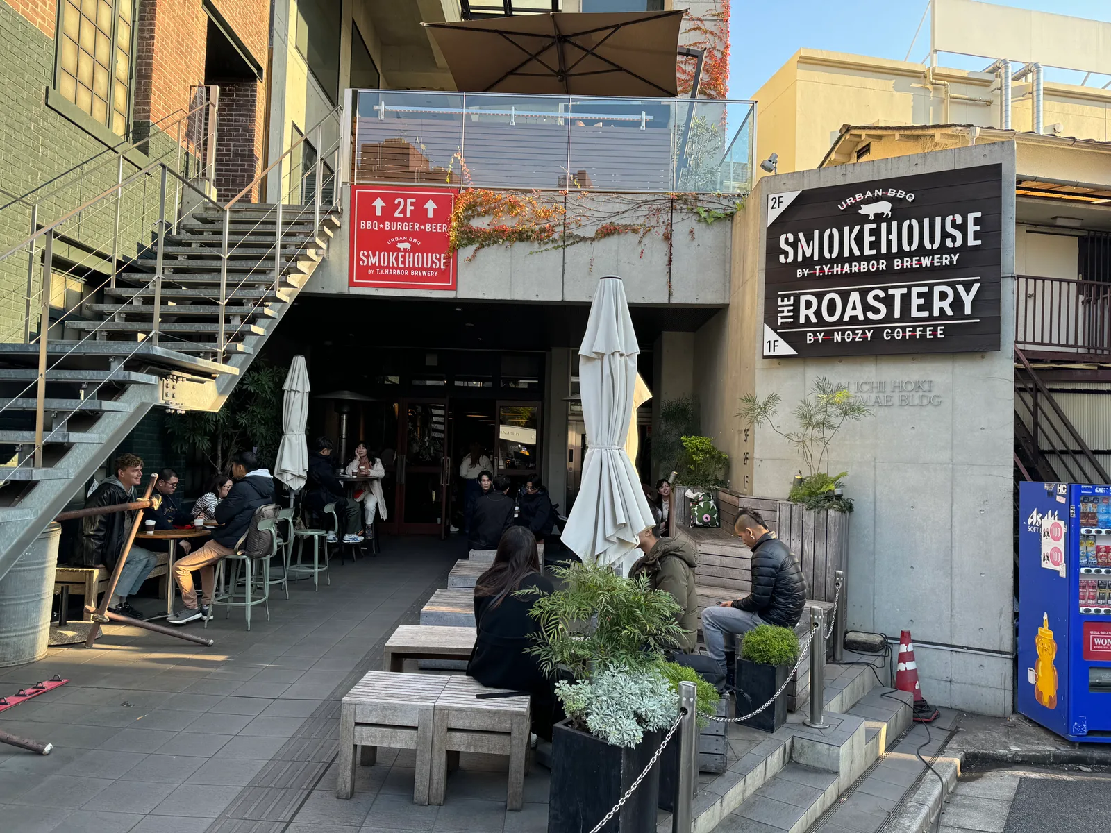urban courtyard with smokehouse restaurant, brewery, and coffee roastery on multiple levels., the roastery by nozy coffee, to