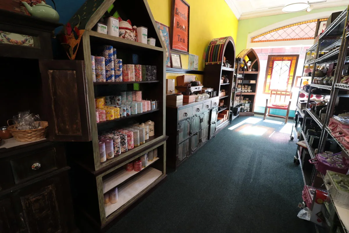 candle shop interior with colorful walls, wooden shelving, and retail displays throughout., the spice merchant & co, wichita
