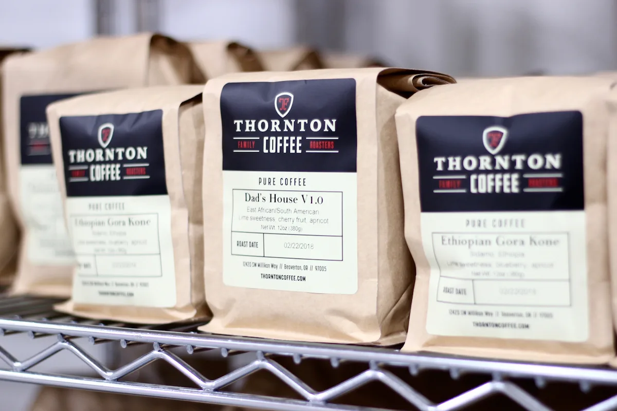 thornton coffee bags displayed on shelf, featuring ethiopian gora kone and dad's house v1.0 blends., thornton family coffee r