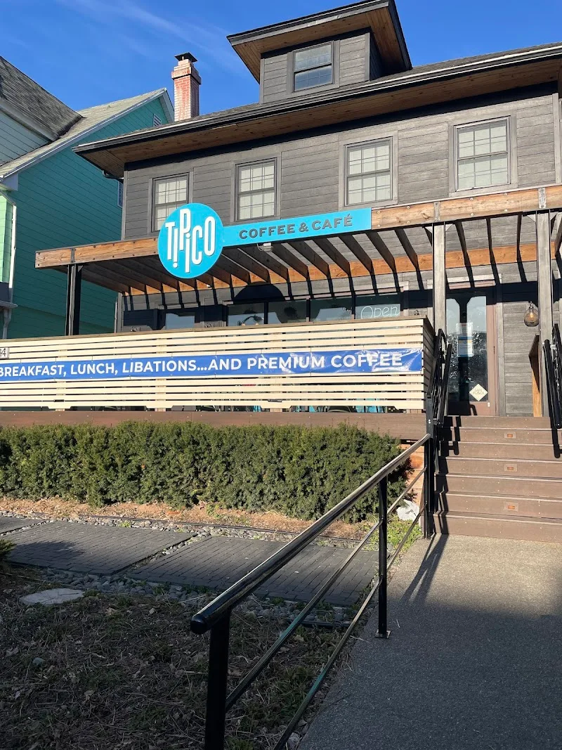 modern mid-century coffee café with turquoise signage and wooden pergola awning., tipico coffee & cafe, buffalo